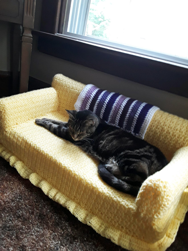 Crocheted cat sofa.