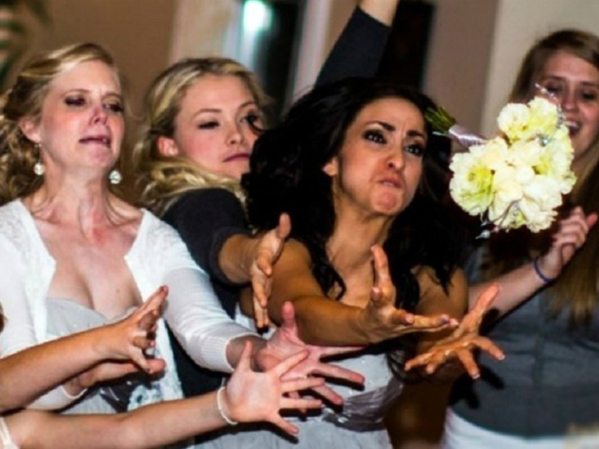 Some bridesmaids REALLY want to catch the bouquet.