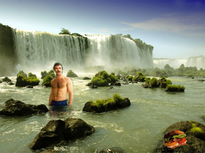 Tom Selleck photoshopped into a waterfall scene with a sandwich.