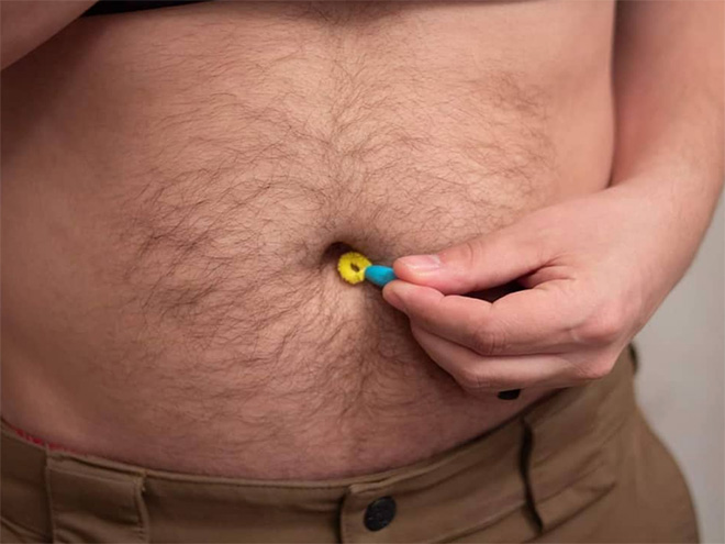 Belly button lint brush.