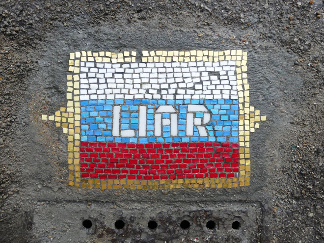 Pothole fixed with mosaic.