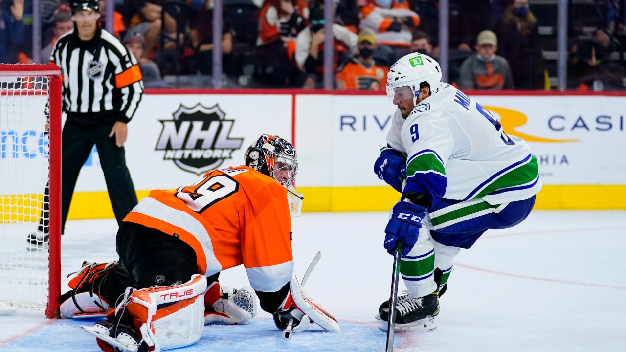 Canucks score twice in shootout to beat Flyers, record first win of season