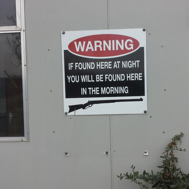 Hilariously threatening warning sign.