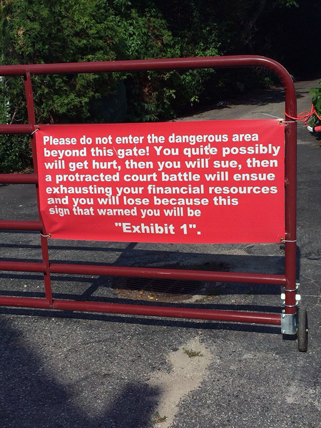 Hilariously threatening warning sign.