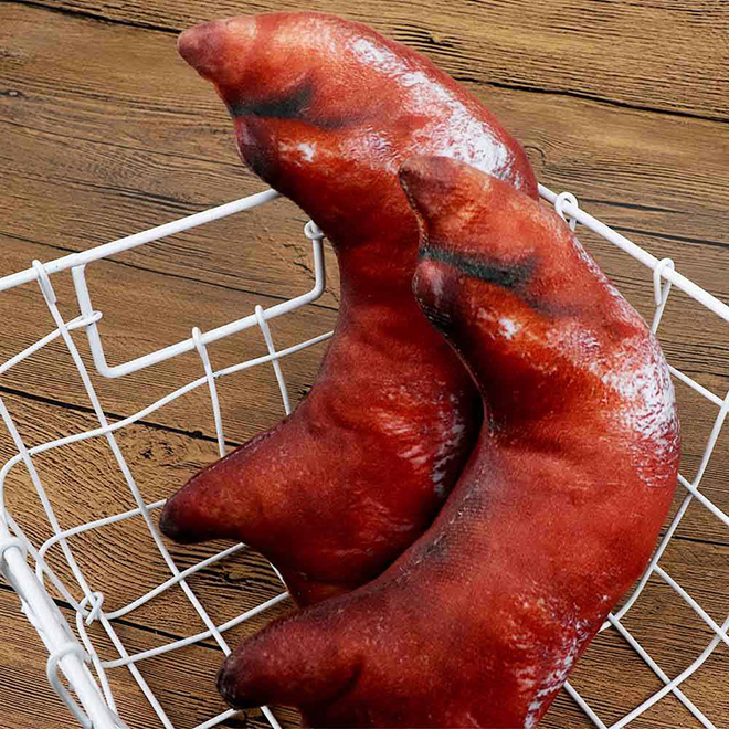 Realistic smoked pig feet pillow.