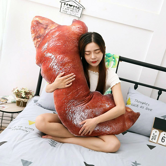 Realistic smoked pig feet pillow.