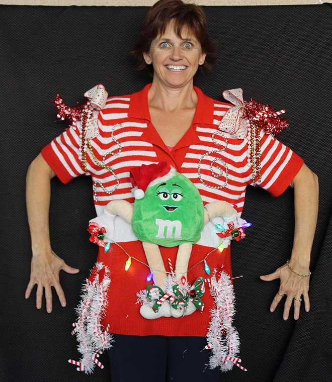 Ugly Christmas sweater with a crazy smile.