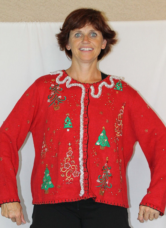 Ugly Christmas sweater with a crazy smile.