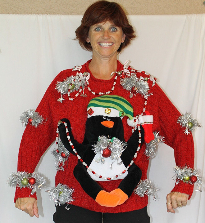 Ugly Christmas sweater with a crazy smile.