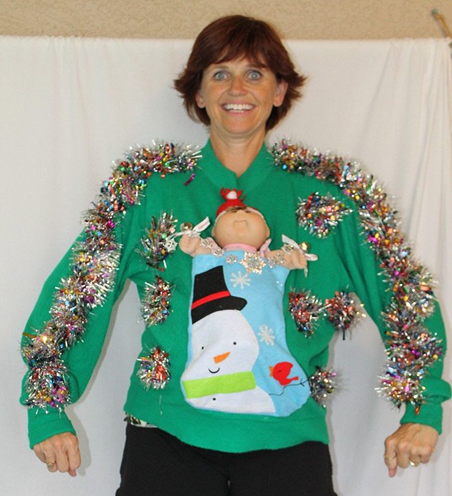 Ugly Christmas sweater with a crazy smile.