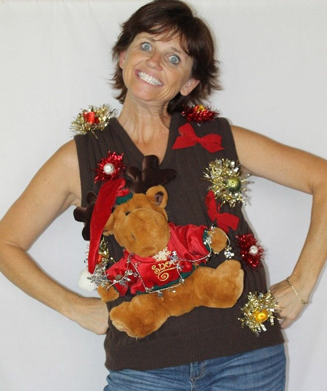 Ugly Christmas sweater with a crazy smile.