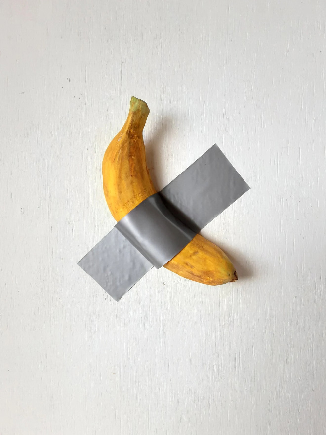 Banana duct taped to a wall.