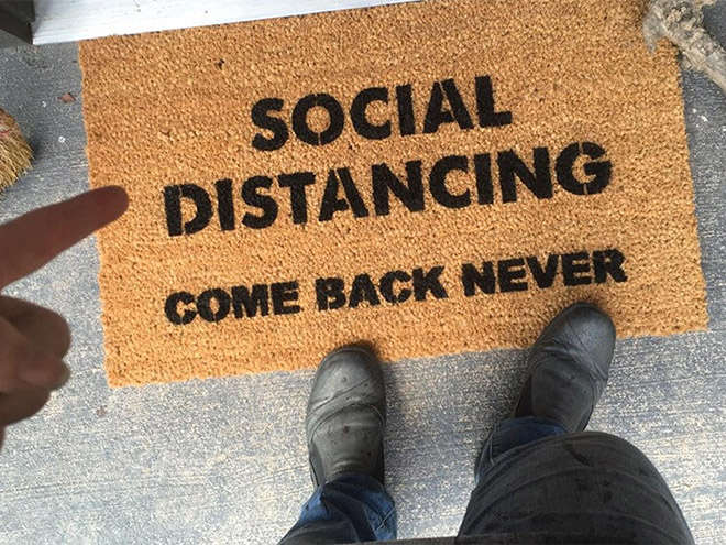 Social distancing doormat.
