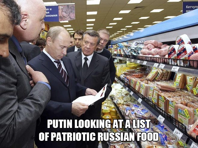 putin looking at a list of patriotic Russian food.