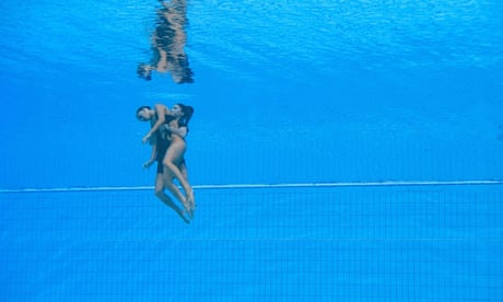 Dramatic rescue at world championships after swimmer faints and sinks to bottom of pool