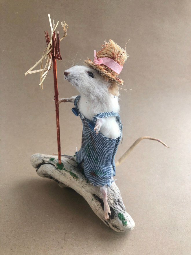 Taxidermy mouse doing stuff.