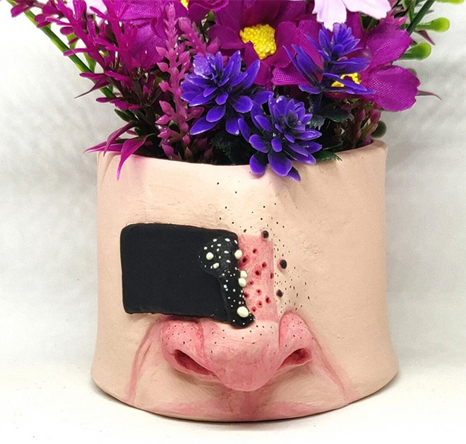 Ugly, weird, creepy pot.