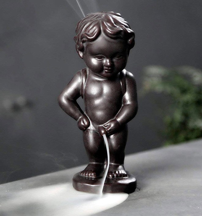 Pissing boy incense burner.