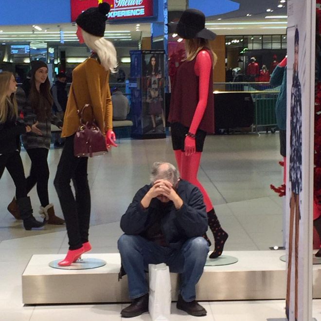 Miserable man trapped in shopping hell.