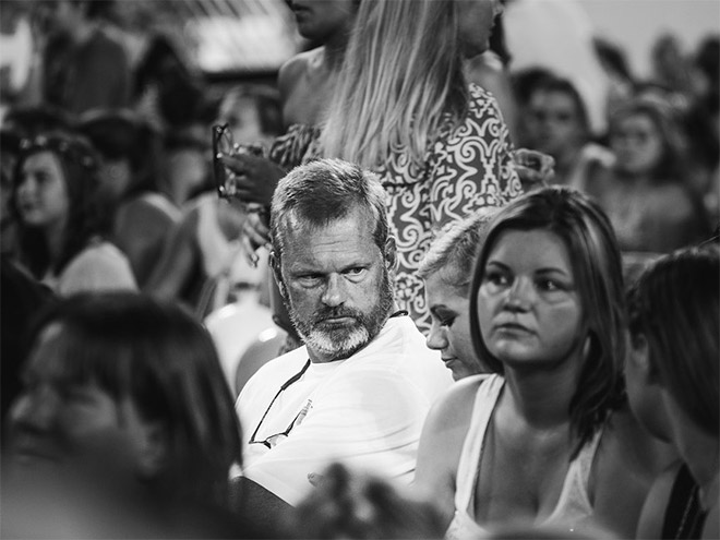 Sad dad who was forced to take his daughter to a concert.