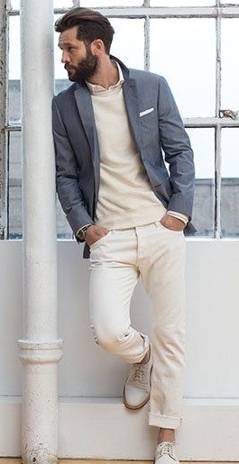 A inner shirt with cream t-shirt and grey suit. Has a white shoes and a watch_