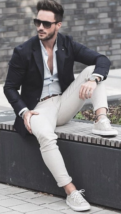 White undershirt with black shirt and cream pants. Wearing it with belt, shades and watch