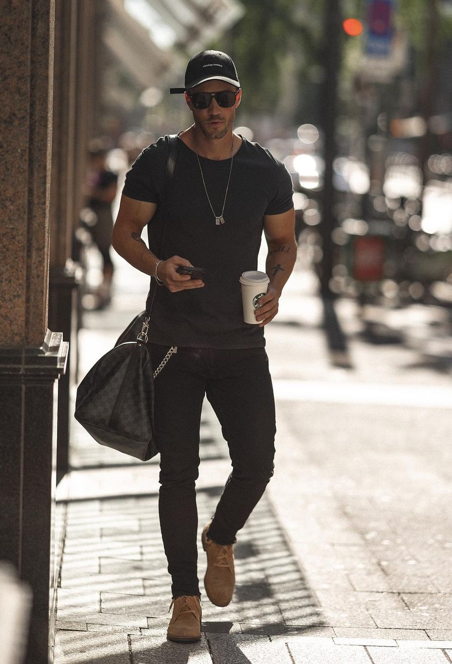 a whole black outfit with tshirt and accessorized with bags and shoes