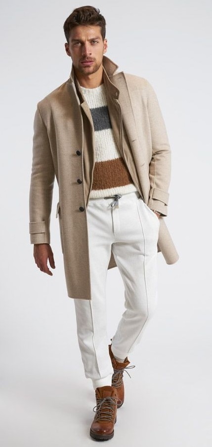 white stripped sweater with shades of brown and grey. Paired with white joggers and brown boots