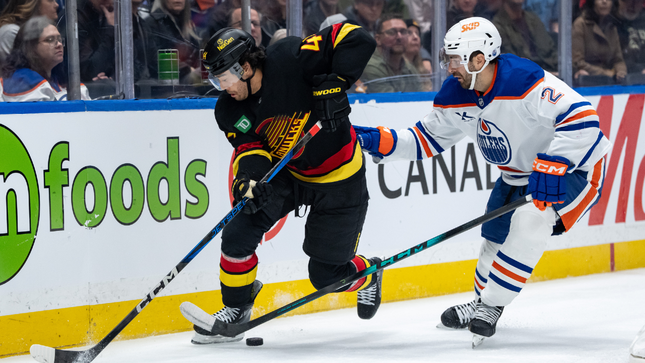 Sherwood scores in overtime as Canucks slip past Oilers