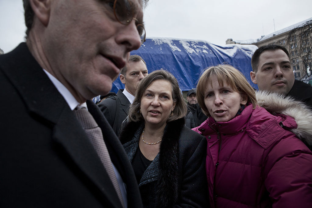 US Assistant Secretary of State Victoria Nuland (C) leaves Maidan Square after meeting with the leaders of the Ukrainian opposition in Kiev, Ukraine, December 10, 2013