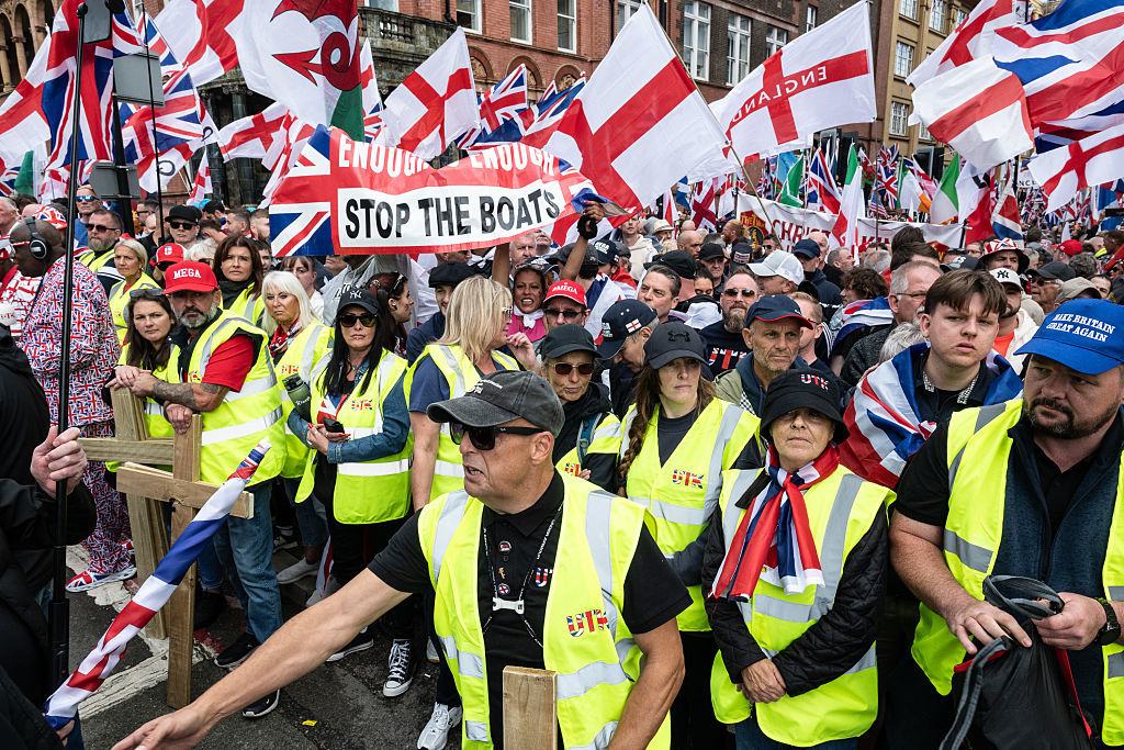 Supporters of Tommy Robinson assemble for the 'Unite the Kingdom' march in London, England, September 13, 2025