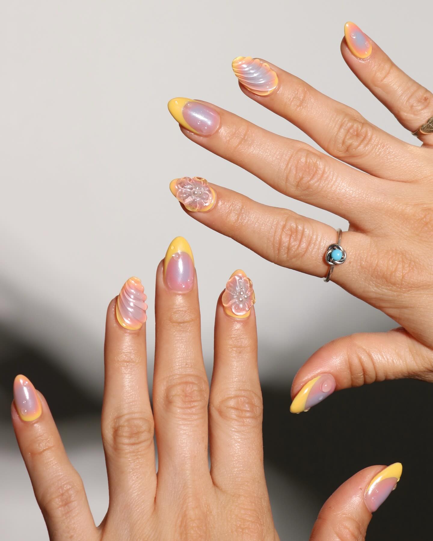 3D yellow chrome nails.