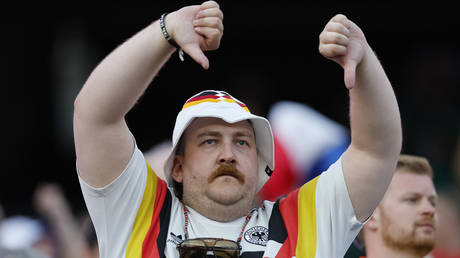 Why the happy face, Merz? Football is just the latest system failing in Germany