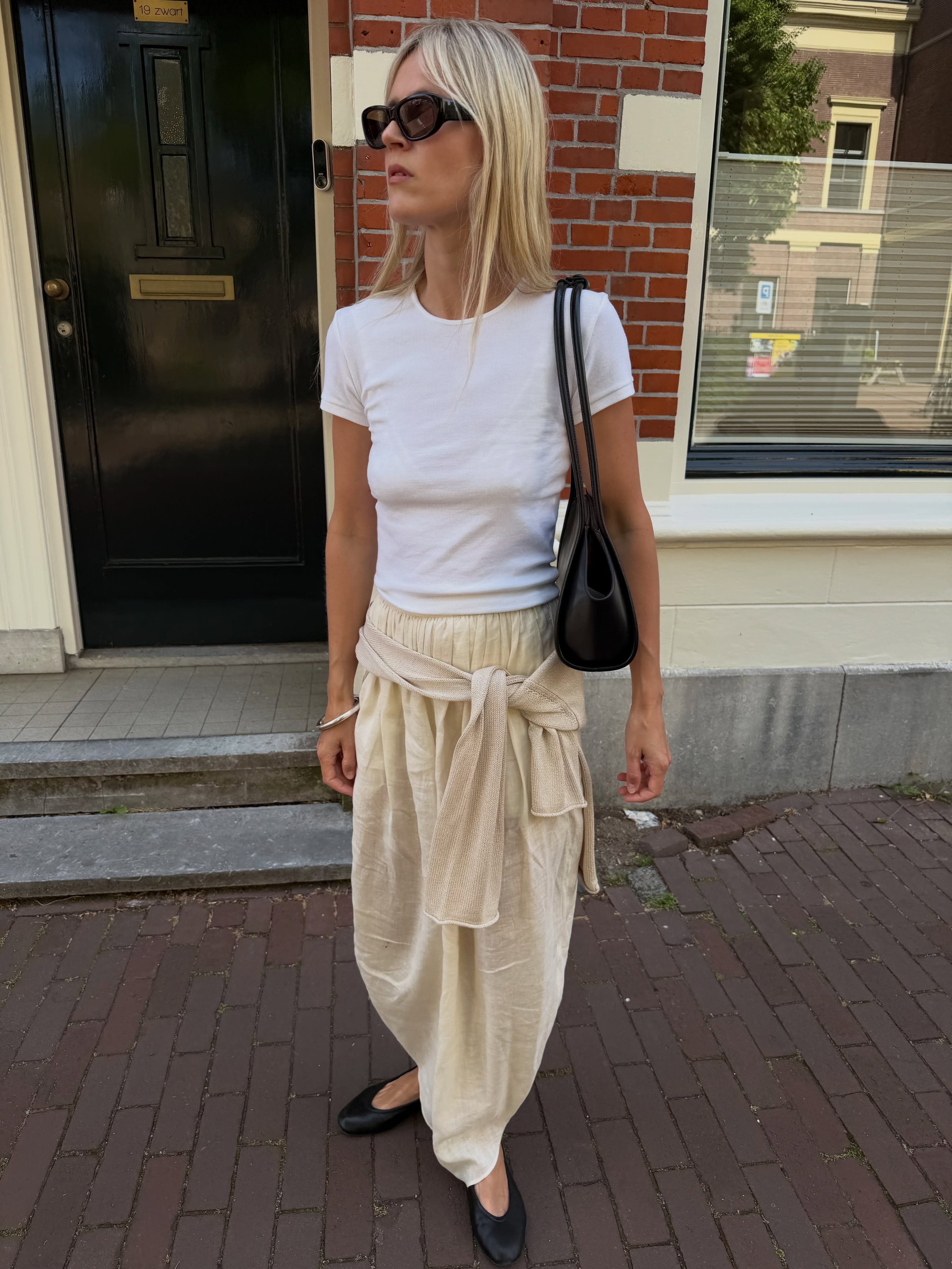 An image of a woman wearing summer ballet flats outfit idea 2026