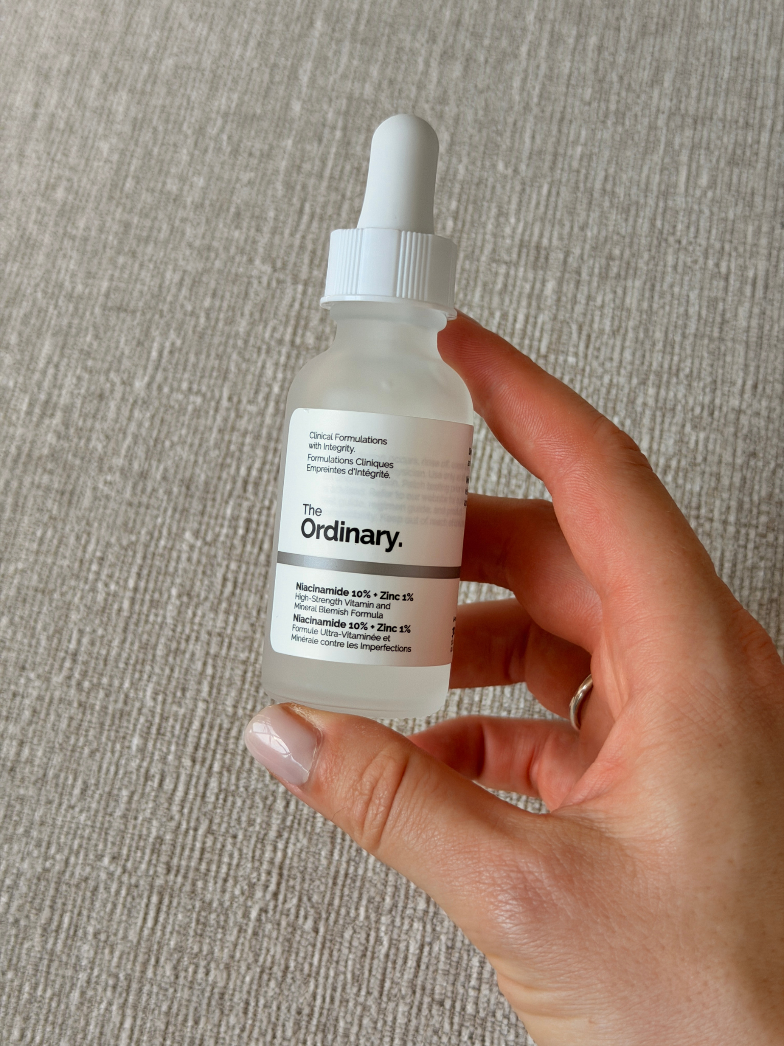 Grace holding The Ordinary Niacinamide 10% + Zinc 1%