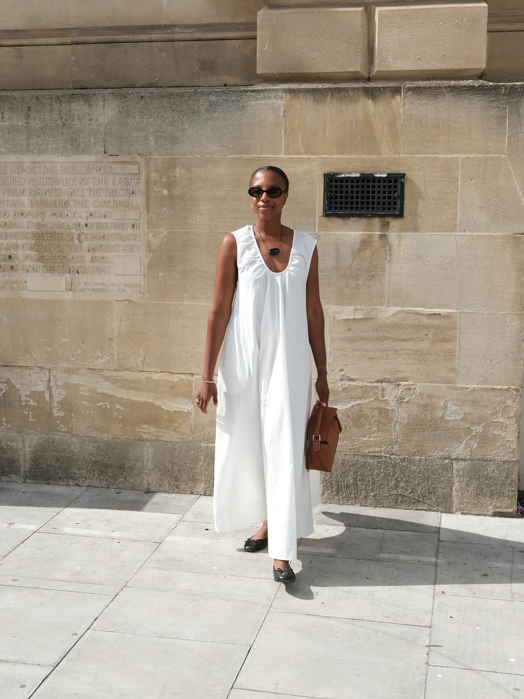 Taffy in white sundress and black ballet flats