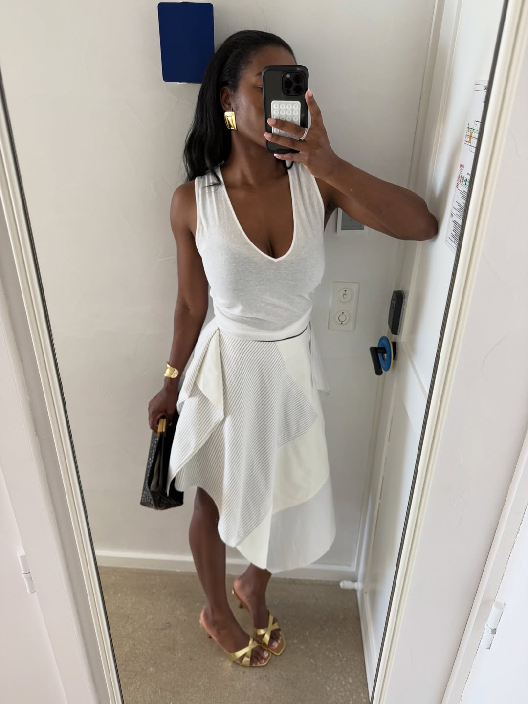 Marilyn in a white v-neck tank