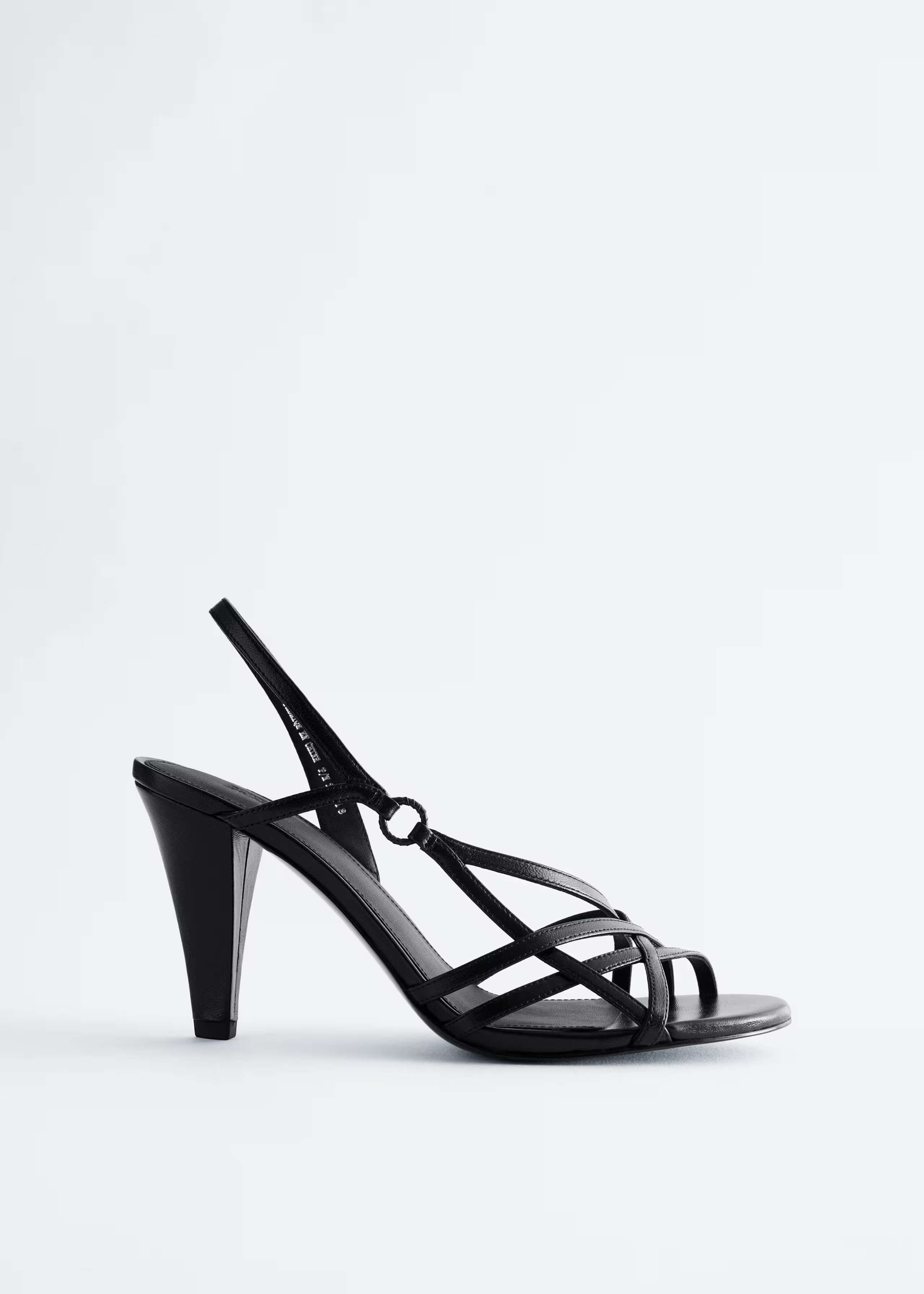 A pair of & Other Stories strappy heels.