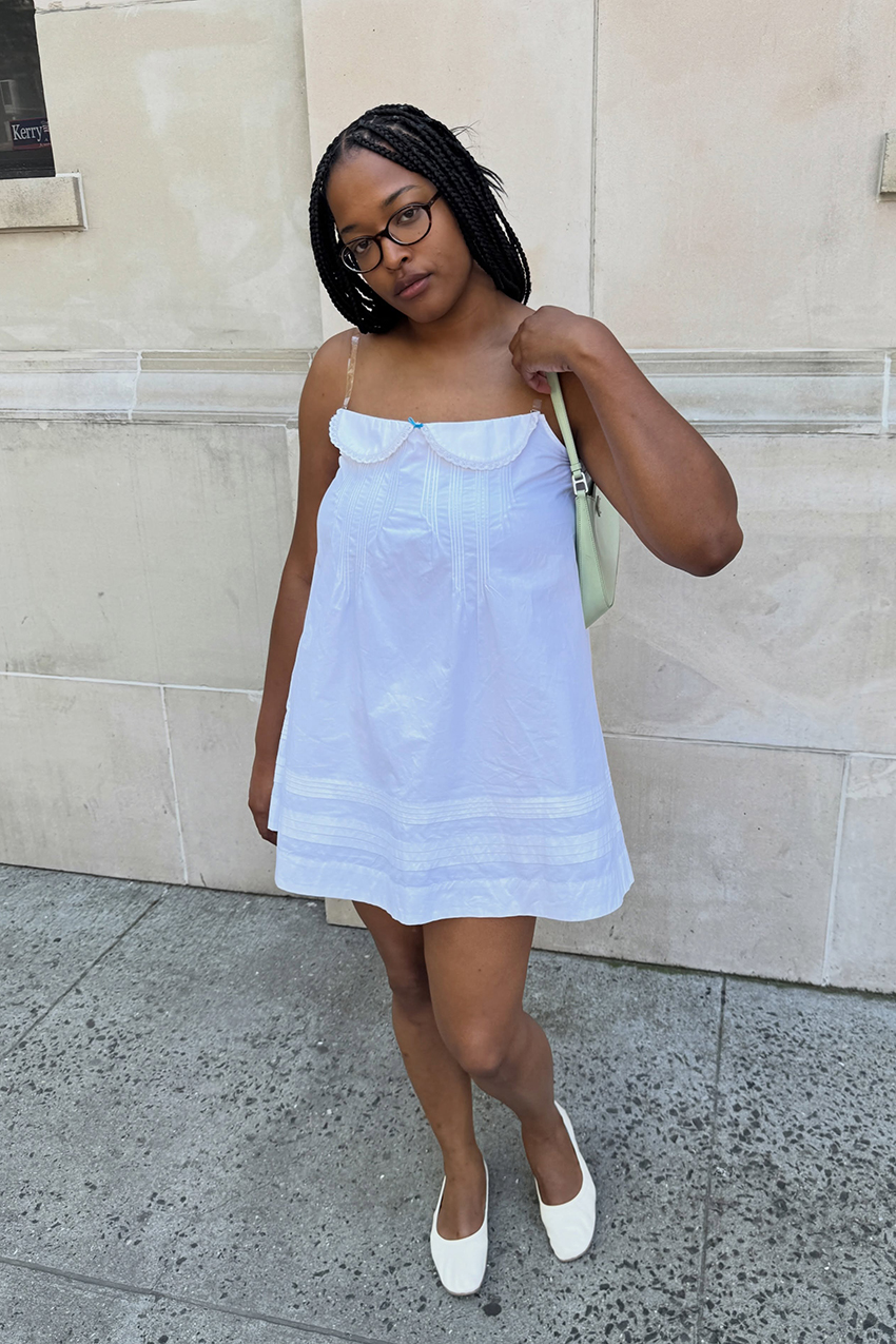 a woman wearing a white sleep dress and white flats