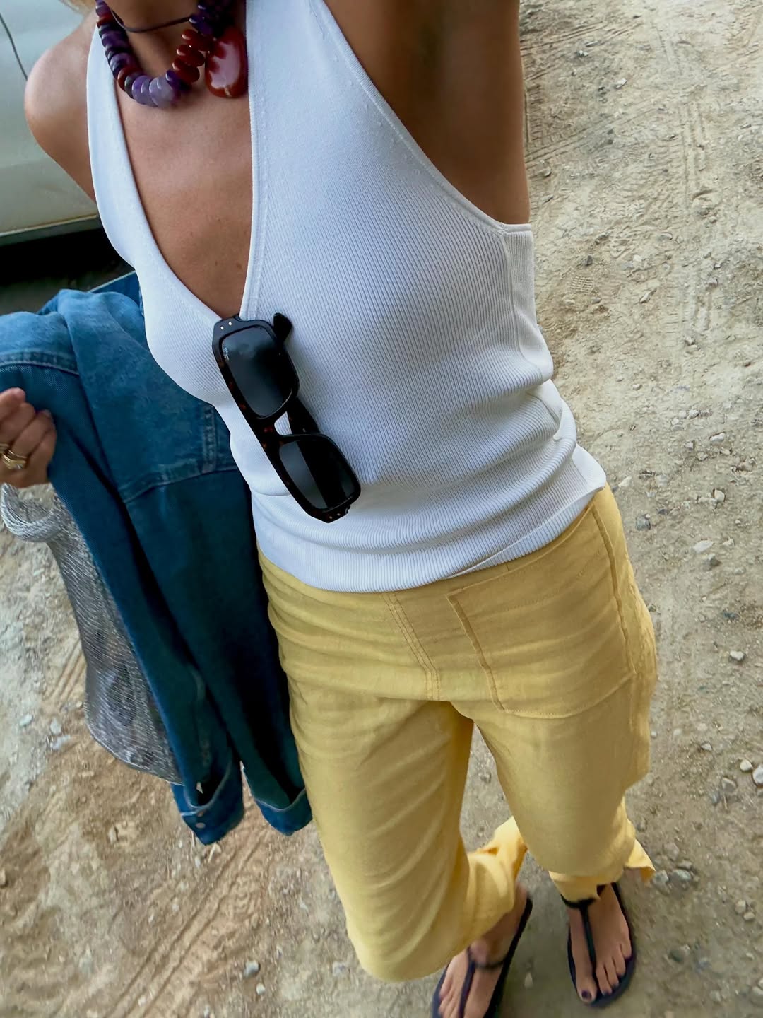 Lucy Williams in a white v-neck tank