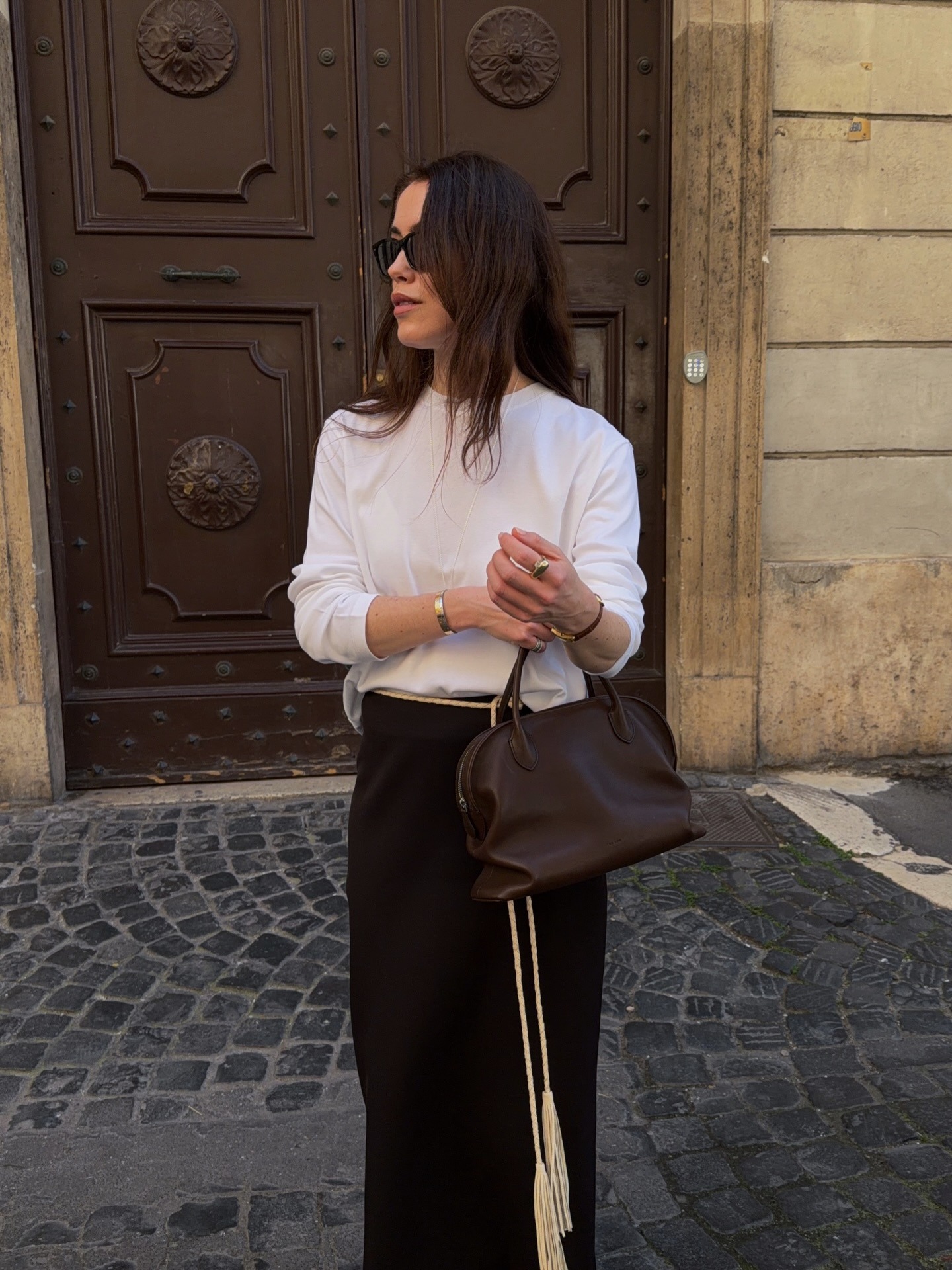 Brown haired influencer wearing The Row Agnes bag