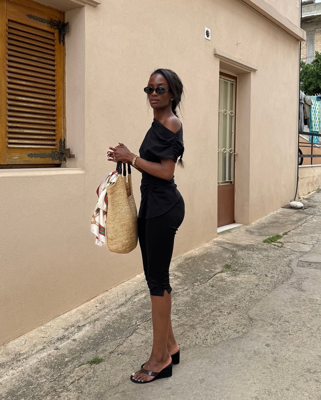 liv madeline wears a black top, black capri trousers and thong wedges: best bottoms to wear with flip flop heels 2026