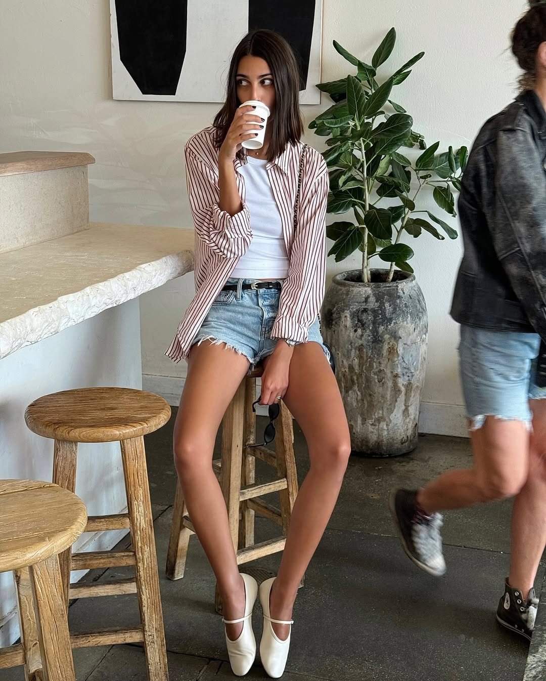 Salom&eacute; Mory in denim shorts and ballet flats