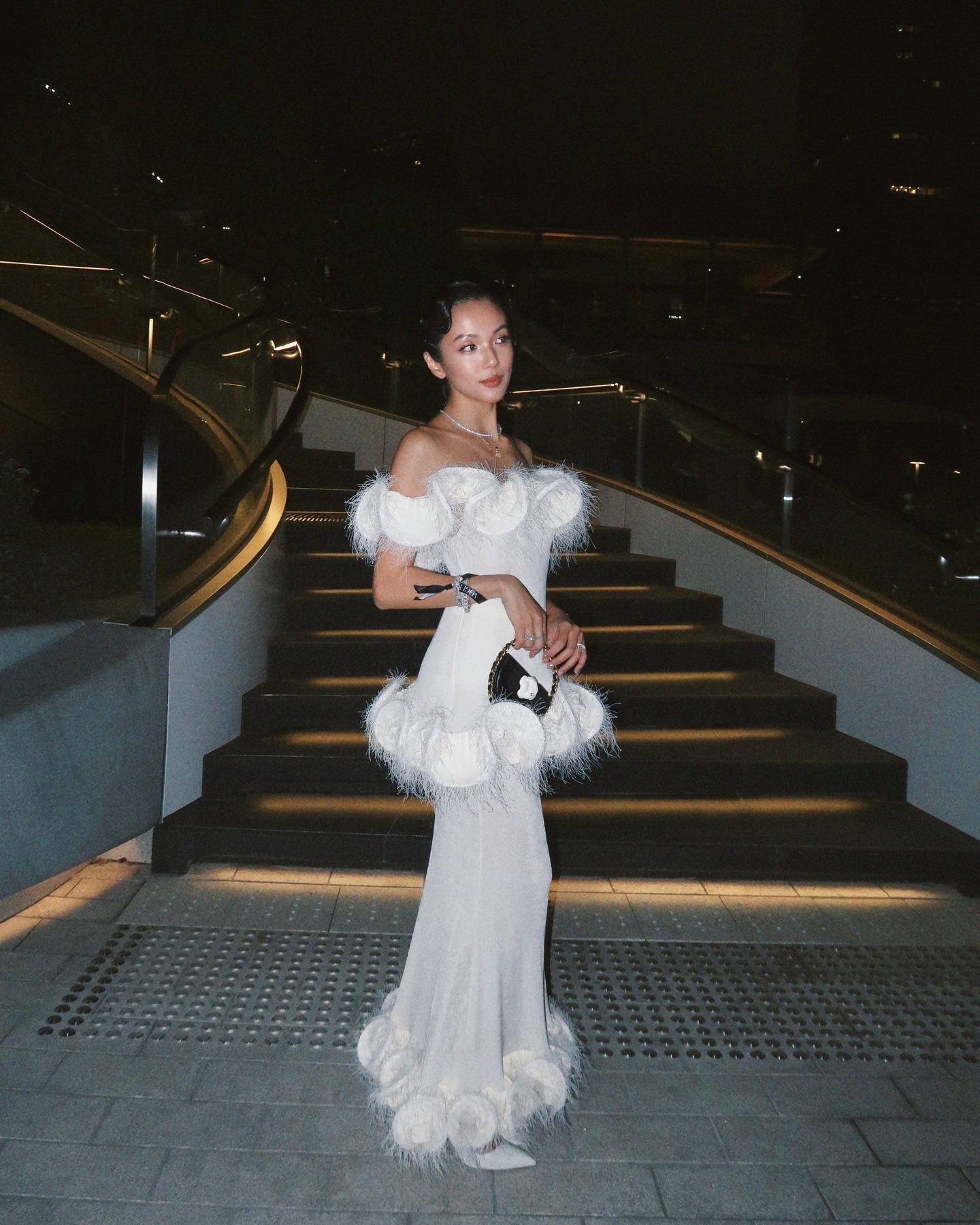Woman wearing white elopement outfit.