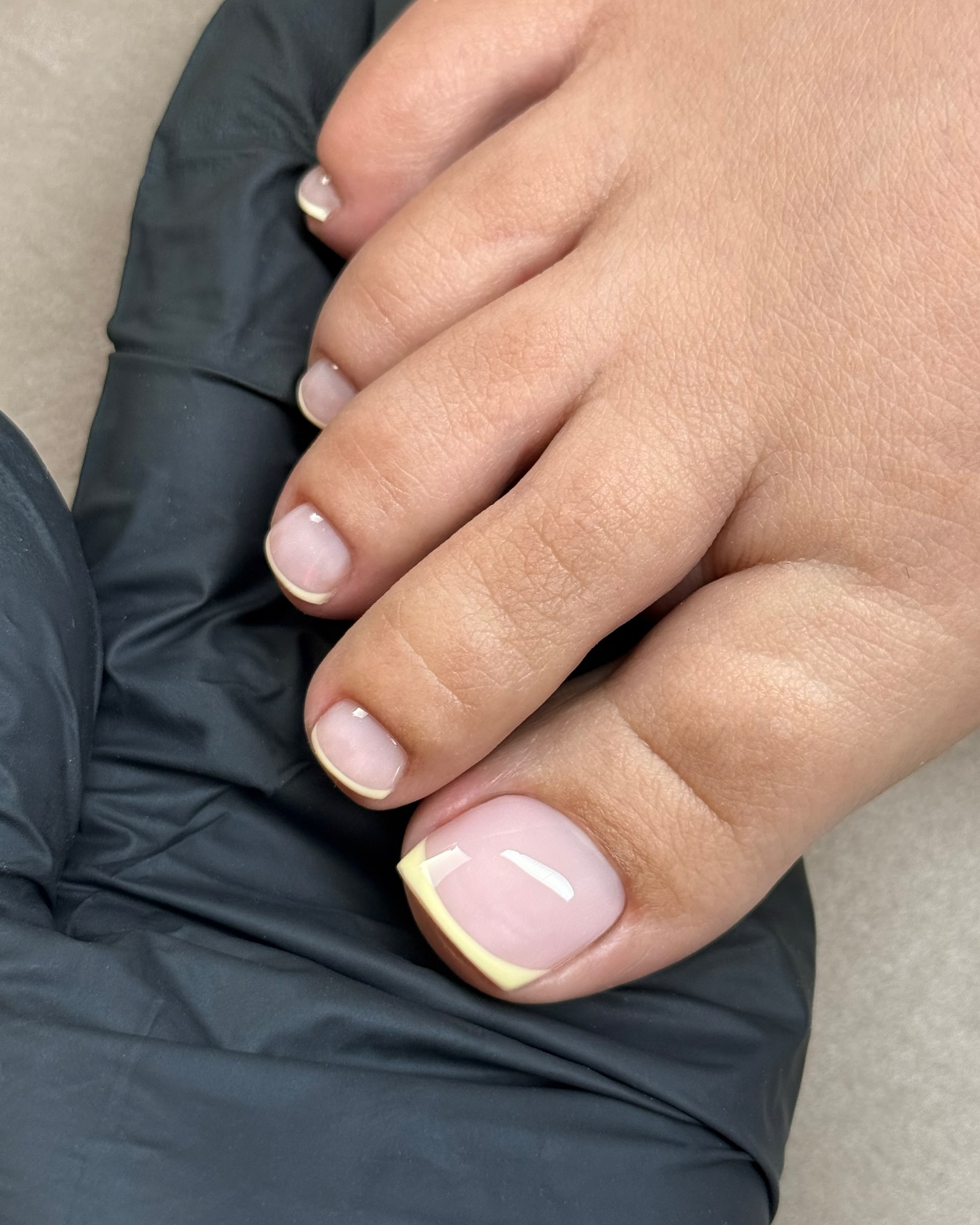 Photo of a square butter French pedicures