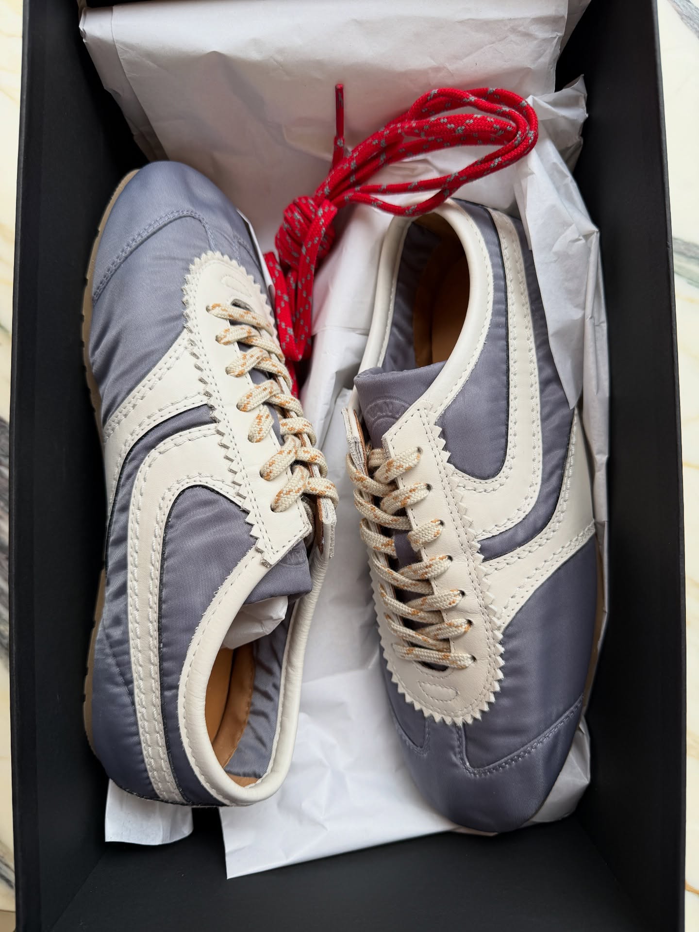 An image of @smythsisters wearing slimline trainers.