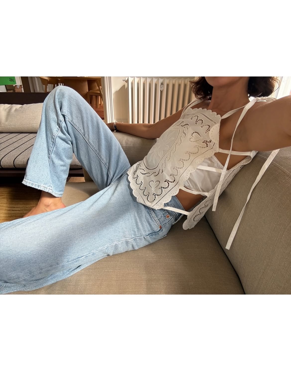 pretty white eyelet top with jeans and shorts outfit