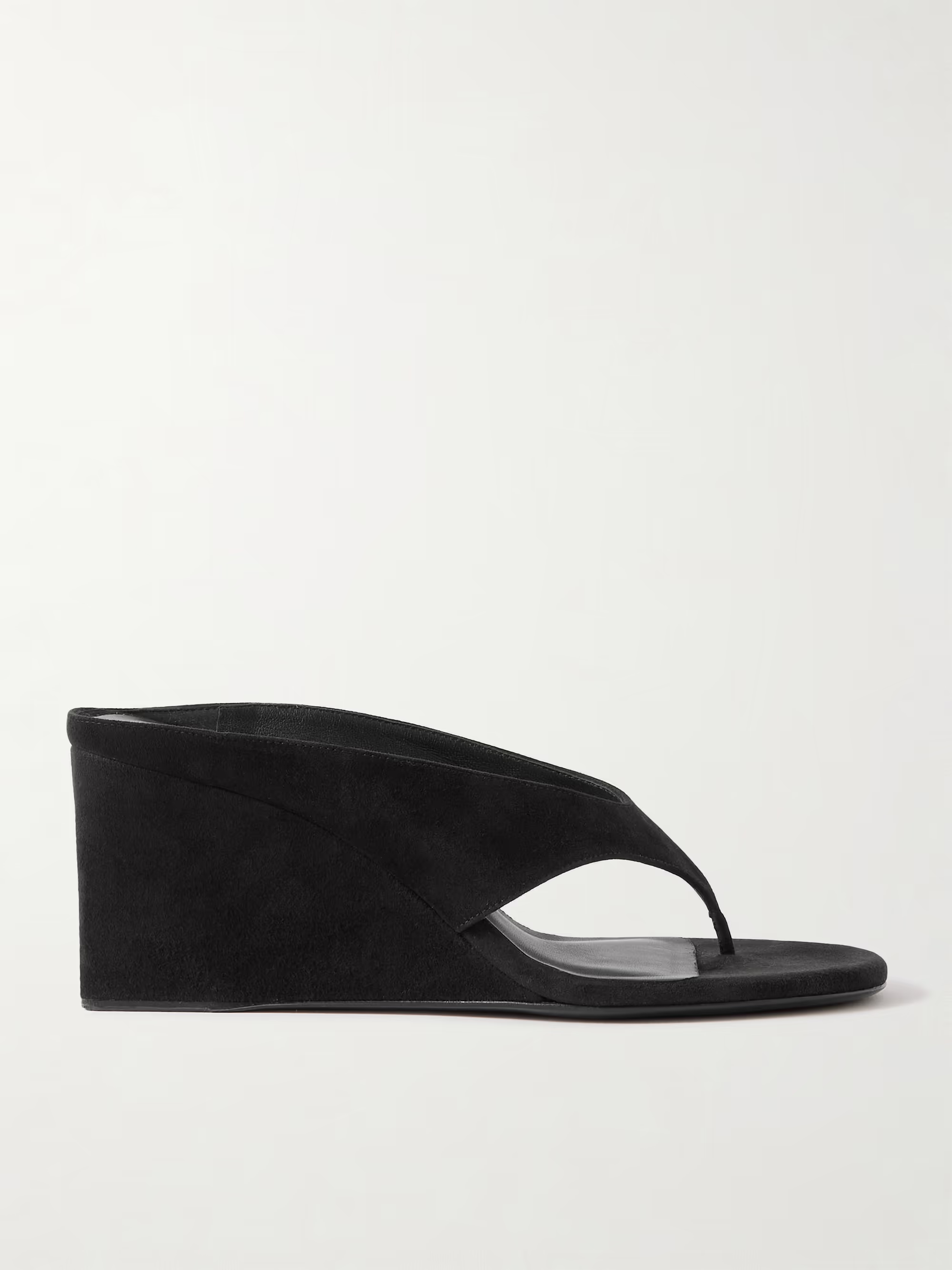 A pair of Ala&iuml;a black thong wedge sandals.