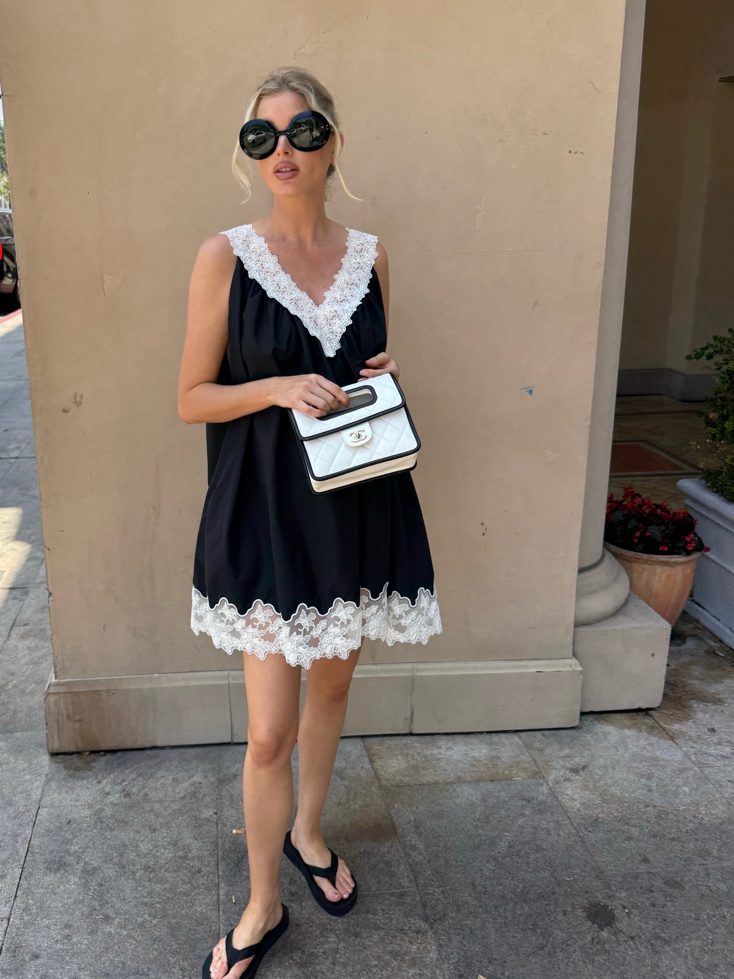 Woman wearing summer dress with flip-flops.