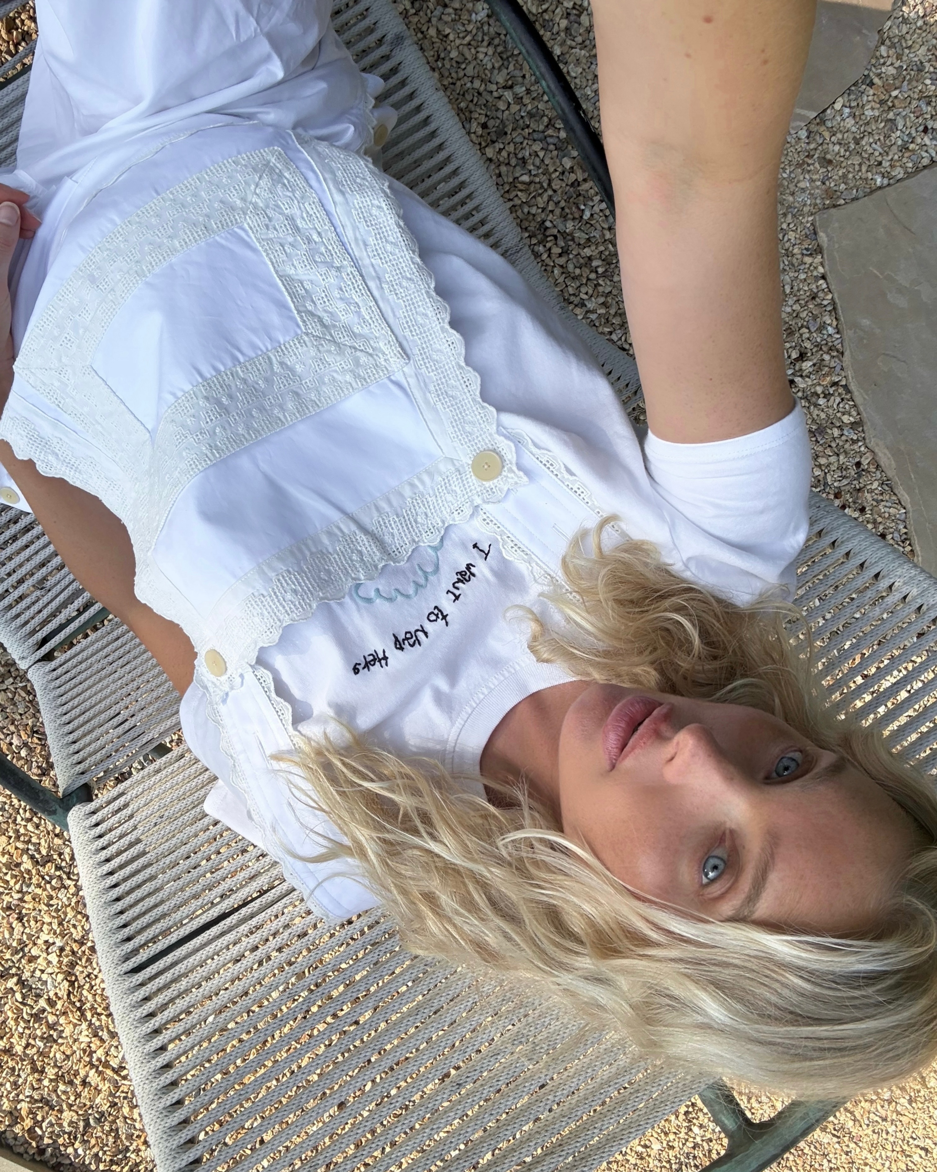 Elsa Hosk wears white apron bib overalls for summer fashion trends 2026